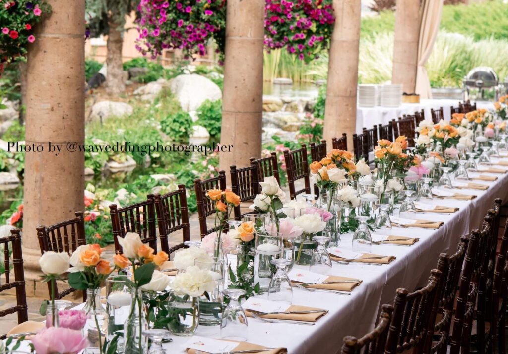 A reception table dressed with flowers